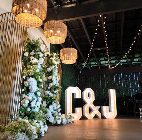 Texan bride and groom taking photo outside of private wedding reception venue - Alegria Gardens