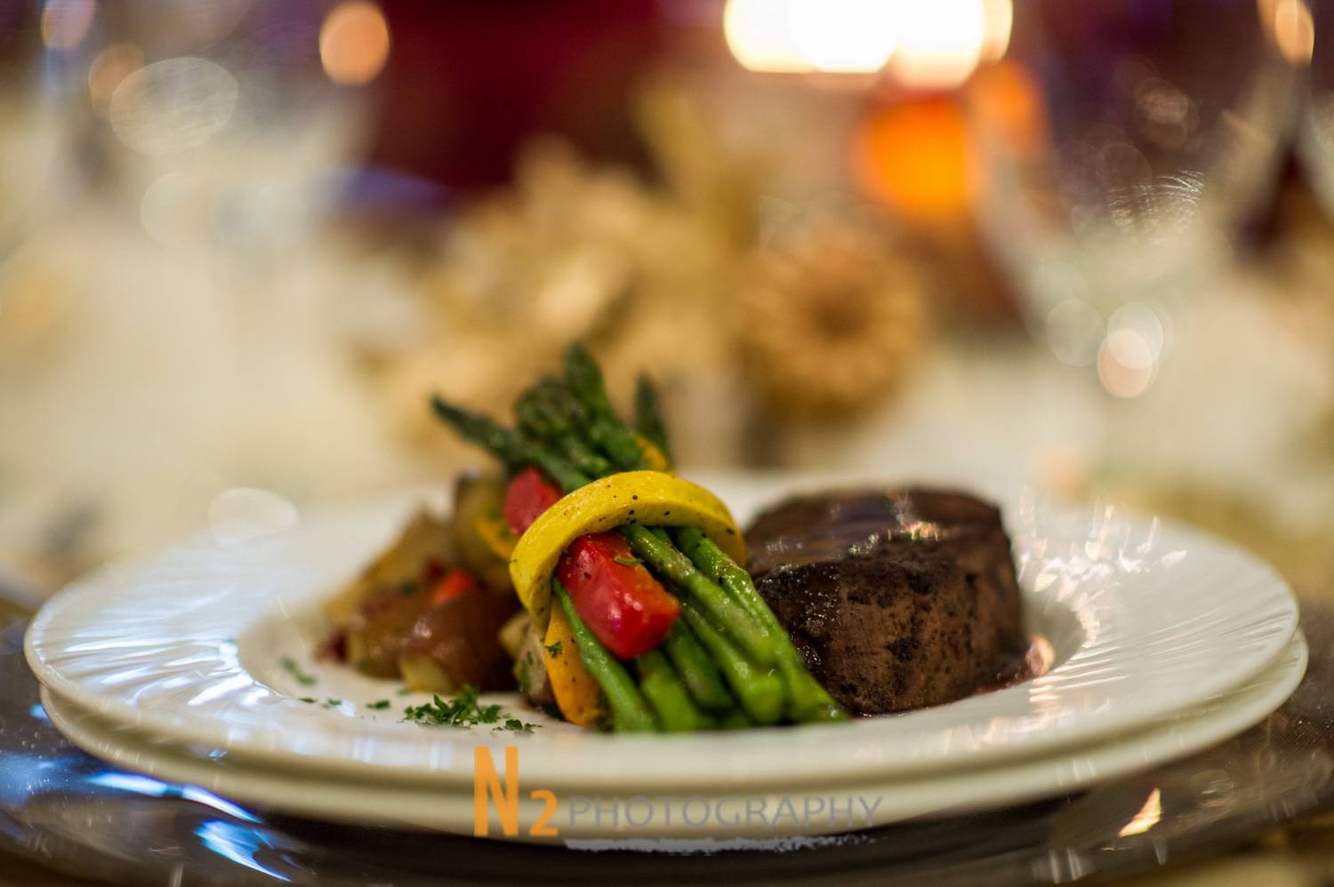 Gourmet plated dinner featuring filet mignon with roasted vegetables, captured by Alegria Gardens, expert event planners in Houston. Gourmet plated dinner featuring filet mignon with roasted vegetables, captured by Alegria Gardens, expert event planners in Houston.